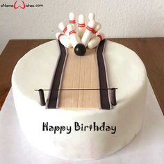 a birthday cake with bowling pins and skis on it that says happy birthday any name here