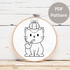 a black and white drawing of a cat wearing a hat