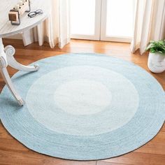 a round rug on the floor in a room