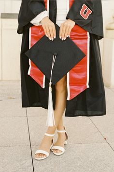 a woman in a graduation gown and cap