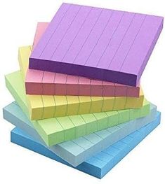 five different colored papers stacked on top of each other