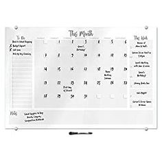 a dry erase calendar on a white board