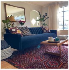 a living room filled with furniture and a large rug