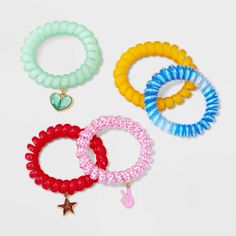 Accessorize your little one's look with the cute Girls' 5pk Phone Cord Bracelet Set from Cat & Jack™. Each bracelet features a unique and adorable phone cord design made of acrylic and zinc alloy. Ideal for easy mixing and matching, these assorted bracelets come with added charms that make for a fun addition to your little one's collection. Cat & Jack™: Designed for all children so you can trust it's made for yours. Sparkle Leggings, Phone Cords, Rainbow Bracelet, Unicorn Rainbow, Elastic Hair Ties, Stretch Bands, Cord Bracelet, Kids Outfits Girls, Cord Bracelets