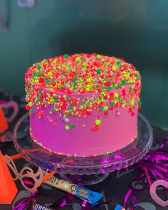 a birthday cake with sprinkles and decorations