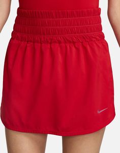 Skirts by Nike Training Training is now in session High rise Elasticized waistband Internal shorts Slip side pockets Nike print detail Regular fit Red Casual Sports Skort, Red Sporty Skort For Sports, Sporty Red Nylon Athletic Shorts, Red Pleated Short Tennis Skirt, Sporty Red Shorts, Formal Dresses Graduation, Cocktail Dress Formal, Nike Training, Winter Party Dress