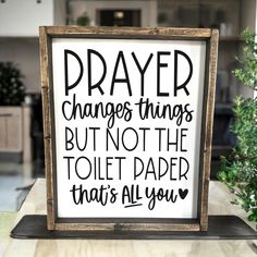 a sign that says prayer changes things but not the toilet paper that's all you