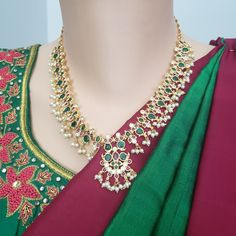 "Handmade Indian Temple Jewelry, best to wear it for traditional ceremonies or Indian wedding. This bridal jewelry has ethnic finish. It has Cubic Zircon stones with ruby and emeralds. It is a Bollywood style one gram jewelry. There are long and short patterns of Indian jewelry in Kundan, Pearls, CZ, American Diamond , ruby, emerald, Polki, kemp to suit every occasion of South Indian and North Indian weddings. Handmade Indian Jewelry item * Stunning Hand made Gold Plated jewelry set. * Necklace Temple Jewelry, Indian Temple, Bollywood Style, Bollywood Jewelry, Ruby Emerald, Necklace Chain Lengths, Indian Weddings, Jewelry Bridal, Set Necklace