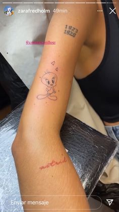 a woman's arm with a tattoo on it that reads i love you and has an image of a monkey