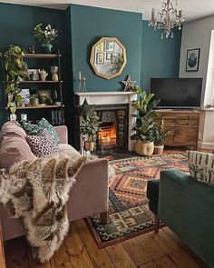 a living room filled with furniture and a fire place