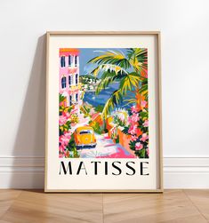 a framed poster with the words matissee on it in front of a white wall