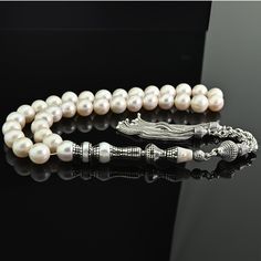 Excellent, It will be sent in a Leatherette gift box, you can print a gift note inside. General: 33 pcs 10 mm beads size  Weight: 66 grams Length: 35 cm including tassel Material: AAA Natural Freshwater Pearl gemstone beads, 925 pure silver metals. Handmade with care. Don't settle for mass-produced items found in stores. Each piece is made by a master craftsman. Constructed using the strongest rope available. Double the lifespan of similar products. Guaranteed to last for many years. Only the fi Elegant Silver Rosary As Gift, Elegant Silver Beads Rosary Gift, Elegant Rosary With Polished Beads For Gift, Elegant Rosary With Polished Beads As Gift, Elegant Gift Rosary With Polished Beads, Silver Rosary With Round Beads For Meditation, Traditional Silver Rosary As Gift, Islamic Prayer, Don't Settle