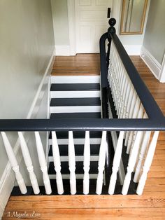 a black and white striped stair rail in a house