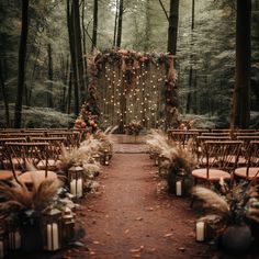 an outdoor ceremony setup with chairs and lights in the woods, surrounded by tall grass