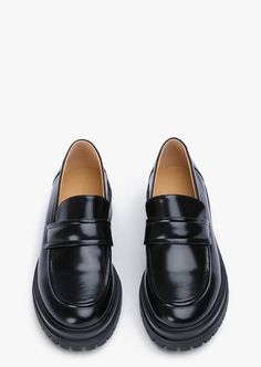 Stand-out from the crowd with our Wiz loafer. Showcasing a shiny black leather exterior, this design features an exaggerated chunky sole with a sleek rounded toe-shape, a high-cut vamp and is finished with a leather upper, lining and cushioned foot-bed. -Material: Leather Upper & Lining -Sole: Man-Made -Fit: We recommend choosing a half size down -Toe-shape: Rounded -Features: Chunky sole -Heel: 4.5cm Modern Black Platform Loafers, Sleek Black Loafers With Round Toe, Modern Black Platform Loafers With Chunky Sole, Modern Black Platform Loafers With Chunky Platform, Modern Formal Platform Loafers With Contrast Sole, Modern Business Platform Loafers With Contrast Sole, Modern Black Platform Loafers With Lug Sole, Black Formal Platform Loafers With Lug Sole, Black Platform Loafers With Lug Sole For Formal Wear