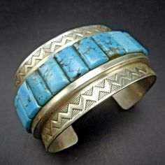 "NAVAJO BRACELET DESCRIPTION: This impressive bracelet is from trending Native American artisan Phillip Morse of Gilbert, Arizona. The perfectly arranged cobblestone inlay of natural Kingman turquoise is framed with carefully applied stamp-work along each edge. This extraordinary bracelet will be a treasured addition to your collection of the very finest Native American jewelry. MEASUREMENTS: Interior of the cuff measures 6 1/4\" with an additional 1 1/2\" non-adjustable gap. Total circumference Navajo Silver Jewelry, Silversmith Jewellery, Bones Bracelet, Gilbert Arizona, Navajo Bracelet, Big Jewelry, Kingman Turquoise, Silver Jewelry Handmade, American Jewelry