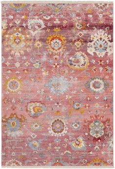 an orange and pink rug with many different colored flowers on the bottom, in front of a white background