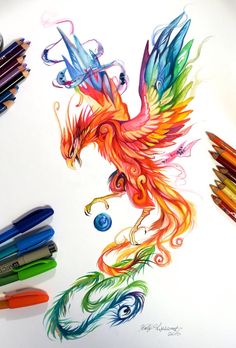 a drawing of a red and orange bird with wings on it's back, surrounded by crayons