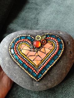 a rock with a heart painted on it