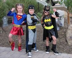 three children dressed up as batman and robin wayne