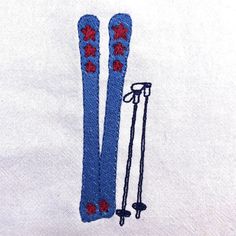 a pair of skis sitting on top of a white towel