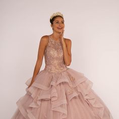 The Delightful Dress Made In The Silhouette Of Ball Gown Has A Structural Top With Halter Neckline Decorated With Delicate Patterns That Together With Sparkling Rhinestones Will Create A Beautiful Image Of A Princess. Fabric: Tulle Length: Long Colour: Mauve Neckline: Halter Silhouette: Ball Gown Sleeve: Sleeveless Back: Sheer, Zipper Skirt: Ruffled Embellishments: Lace, Rhinestones Occasion: Romantic Date/Evening/Dinner, Wedding/Bridesmaid, Graduation, Fashion Show, Visiting Theater/Museum/Rest Sleeveless Ruffled Ball Gown For Quinceanera, Sleeveless Gown With Ruffles For Quinceanera, Sleeveless Ruffled Gown For Quinceanera, Organza Ruffle Dress For Quinceanera, Sleeveless Ruffle Dress For Debutante Ball, Sleeveless Organza Ball Gown With Ruffles, Sleeveless Organza Quinceanera Dress, Sleeveless Ruffled Ball Gown For Gala, Sleeveless Gown With Ruffles For Debutante Ball