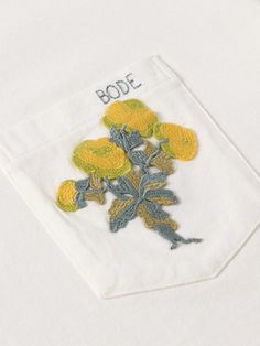 BODE's T-shirt is influenced by traditional tablecloths from the '50s. It’s made from cotton-jersey and has the logo and a bouquet embroidered on the chest patch pocket. Bode Embroidery, Bode Shirt, Print Techniques, Cuban Shirts, Embroidery Shirt, Patches Shirt, Creative Services, Shirt Pocket, White Shoes Sneakers