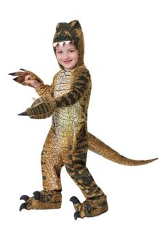 a young boy dressed in an adult sized dinosaur costume, holding a bird and pointing to it's left side