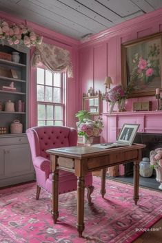 a living room with pink furniture and flowers on the fireplace mantel, along with an area rug