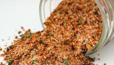 a jar filled with spices sitting on top of a table