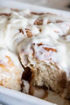 a close up of a cake with icing on it in a white dish,