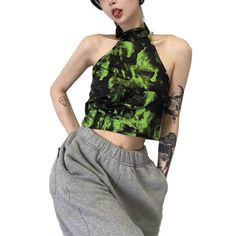 Unleash your inner alt-girl spirit with our Acid Green Tie-Dye Women Halter Neck Top. Embodying the vibrant trippy aesthetic with a hint of dark rave fashion, this piece is sure to elevate your everyday style. Crafted from high-quality polyester mesh, this halter neck crop top doesn't just look good; it feels good, too. Its lively acid green color will add a burst of personality to any outfit. Suitable for e-girl style, TikTok outfits, and alternative aesthetic trends, this top is a must-have for those who dare to stand out. Plus, we've got your convenience in mind, offering free shipping in the US and worldwide. Unisize - Chest: 80-90 cm (31.5-35.4 inches); Length: 39 cm (15.4 inches) Feeling the vibe yet? Our Acid Green Tie-Dye Halter Neck Top offers a plethora of benefits, making it a s Alt Girl Aesthetic, E Girl Style, Halter Neck Crop Top, Tiktok Outfits, Green Tie Dye, Tie Dye Women, Rave Fashion, Tie Dye Crop Top, Alt Girl