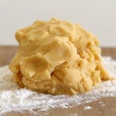 a cookie is sitting on top of some flour