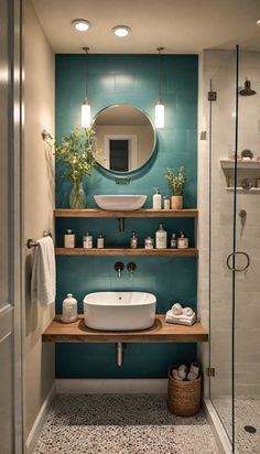 a bathroom with a sink, mirror and shelves on the wall next to each other