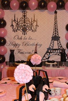 a birthday party with pink and black decorations