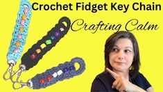 the crochet fidget key chain is shown with an image of a woman pointing at