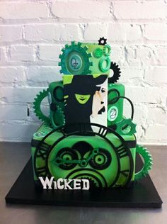 a cake made to look like a steam engine with gears on it's sides