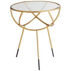 a round glass table with metal legs and a gold finish on the top, against a white background