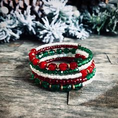 Beautiful holiday memory wire bracelet is perfect for this season. It is for all of you Christmas lovers, this beauty is made with festive red and green Czech glass and Japanese seed beads. Memory wire bracelets will fit any wrist size and wont lose its shape, which makes it a Perfect gift for a loved one! #etsyshop #beadedbracelets #wishlist #christmasjewelry #holidayjewelry #bohemianjewelry Memory Wire Christmas Bracelets, Bohemian Round Bead Bracelets For Holiday, Festive Stackable Beaded Bangle Bracelets, Bohemian Festive Bracelets With Faceted Beads, Bohemian Beaded Bracelets With Round Beads For Holiday, Wire Wrapped Multi-strand Bracelets For Gifts, Multi-strand Wire Wrapped Bracelet As Gift, Adjustable Festive Bracelets With Faceted Beads, Festive Bracelets With Faceted Beads