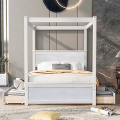 a white bed sitting on top of a wooden floor next to a wall mounted clock