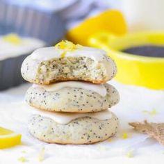 three lemon poppy seed donuts stacked on top of each other