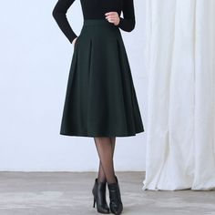 "More color: https://etsy.me/3NgO20M ★★ FEATURES * Wool skirt * Polyester lining * Two side seam pockets * Right zipper closure * pleated detail * Plus size full skirt * A Line Skirt * Perfect for Winter, autumn, spring * Dry clean ★★ The model is 170 cm (5′ 7″) tall with a 80 cm (31.5\") bust, 66 cm (26\") waist. She is wearing the green wool skirt in size XS. ★★ Bespoke Order Service If you Request other color Request the length Your height is not between 155 cm- 172 cm Your weight is over 75 Chic A-line Winter Skirt, Winter Wool A-line Skirt, Chic Winter A-line Pleated Skirt, Fitted A-line Skirt For Winter, Fitted A-line Pleated Skirt, Fitted Winter Skirt For Office, Fitted Skirt For Office In Winter, Green Winter Midi Skirt, Fitted Full Pleated Skirt In Solid Color