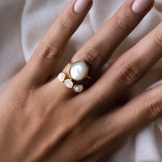 This gold statement ring set includes the luminous Mother of Pearl Ring - Margit and Moonstone Ring - Elisa.

The mother of pearl stone (Margit) measures at 12mm x 10mm.

Each rainbow moonstone (Elisa) measures at 5mm in diameter.
 Moonstone Ring - Elisa (Size): 3, 4, 5, 6, 7, 8, 9, 10; Mother of Pearl Ring - Margit (Size): 4, 5, 6, 7, 8, 9, 10 Mother Of Pearl Ring, Pearl Stone, Gold Statement Ring, Pearl Jewellery, Big Rings, Rainbow Moonstone Ring, Detailed Ring, Statement Ring Silver, Sustainable Jewelry