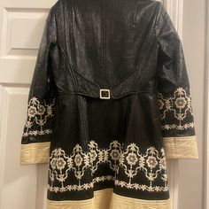 This Is A Size 6, And Is In Great Shape. All Of The Embroidery Is Impeccable, It Is Black And Cream Colored. It Is Very Flattering. Elegant Winter Outerwear With Floral Embroidery, Luxury Spring Outerwear With Floral Embroidery, Elegant Floral Embroidered Winter Outerwear, Luxury Long Sleeve Outerwear With Floral Embroidery, Designer Embroidered Fall Outerwear, Chic Fitted Outerwear With Floral Embroidery, Designer Embroidered Outerwear For Fall, Cream Long Sleeve Outerwear With Floral Embroidery, Designer Embroidered Fitted Outerwear