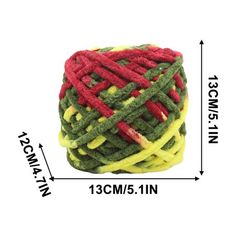 a ball of yarn with red, yellow and green stripes on the end is shown