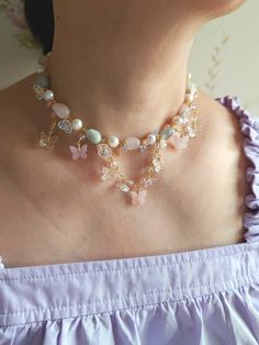 Transform into an ethereal butterfly with this Dream Butterflies Necklace. Crafted with pastel blue and pink morganite beads, lustrous freshwater pearls, and romantic butterfly and flower charms, this beautiful necklace is a must-have for butterfly lovers. 🍃Fairytale vibe with the pastel pink and blue beads and butterfly charms. 🍃Handcrafted with morganite beads, freshwater pearls, acrylic beads, glass beads and gold-plated findings. 🍃All variations come with a 5cm extender. Pink Pearl Beaded Necklace, Whimsical Handmade Pink Necklace, Whimsical Pink Beaded Necklace, Butterflies Necklace, Whimsical Handmade Butterfly Necklace, Adjustable Beaded Fairycore Necklace, Ethereal Butterfly, Handmade Pink Butterfly Necklace, Pink Fairy Necklace