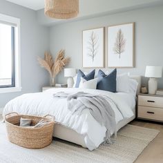 a bedroom with two pictures on the wall above the bed