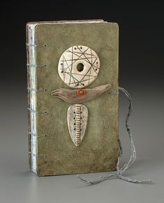 an altered book with a skeleton on the cover