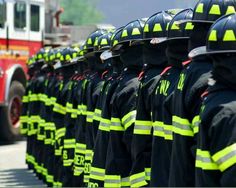 there are many fire fighters lined up in uniform with the words it's the life you live, it's the job you love