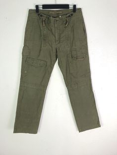 Combat Style Khaki Work Pants With Pockets, Khaki Combat Pants With Pockets, Military Style Khaki Pants With Pockets, Tactical Khaki Pants With Pockets, Combat Cotton Pants With Hip Pockets, Cotton Combat Pants With Hip Pockets, Military Style Cotton Work Pants With Multiple Pockets, Military Style Cotton Work Pants With Cargo Pockets, Military Cotton Cargo Work Pants